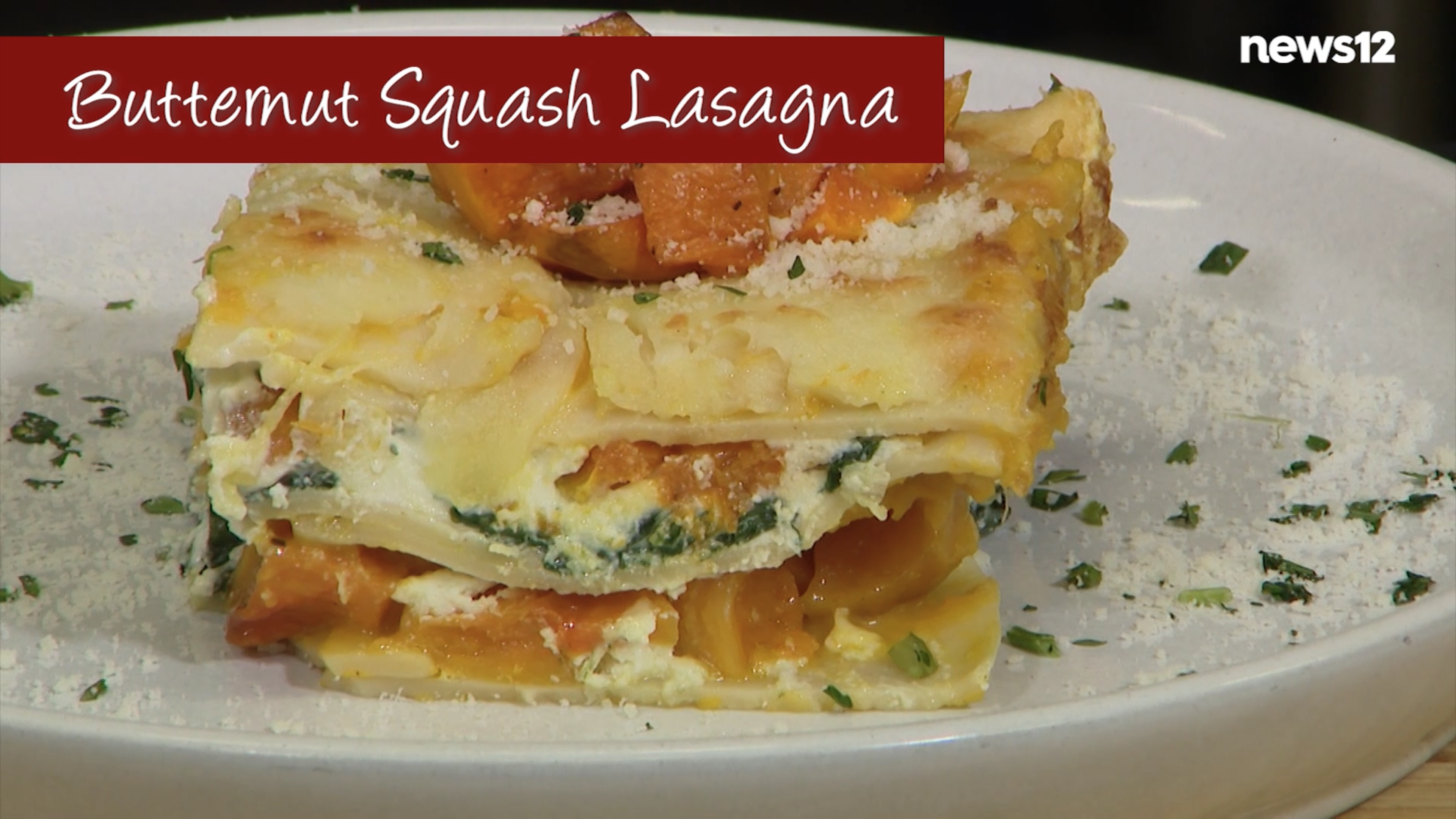 Butternut squash lasagna on a white plate with the text "butternut squash lasagna" on it