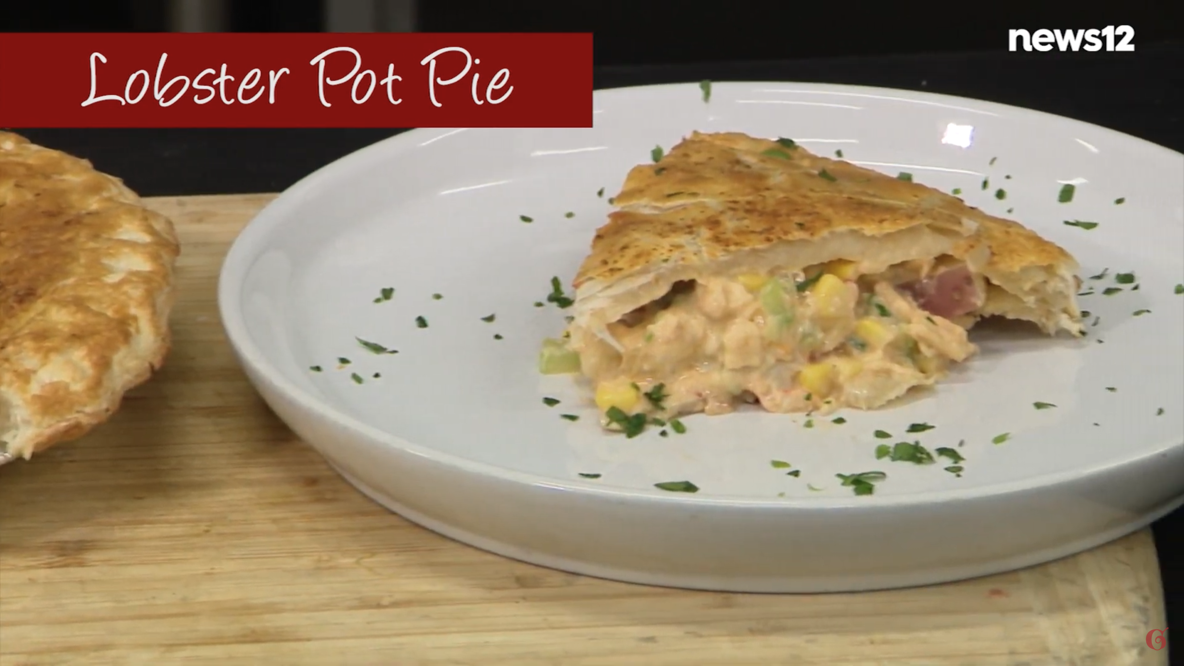 lobster pot pie slice on a white plate