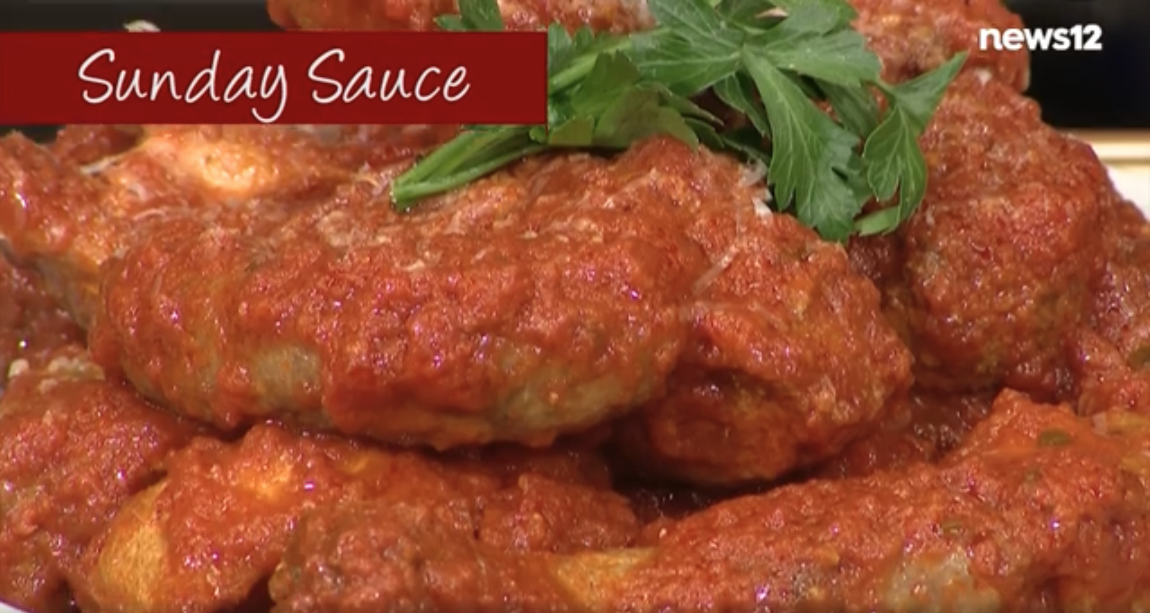 meatballs and sausage covered in tomato sauce