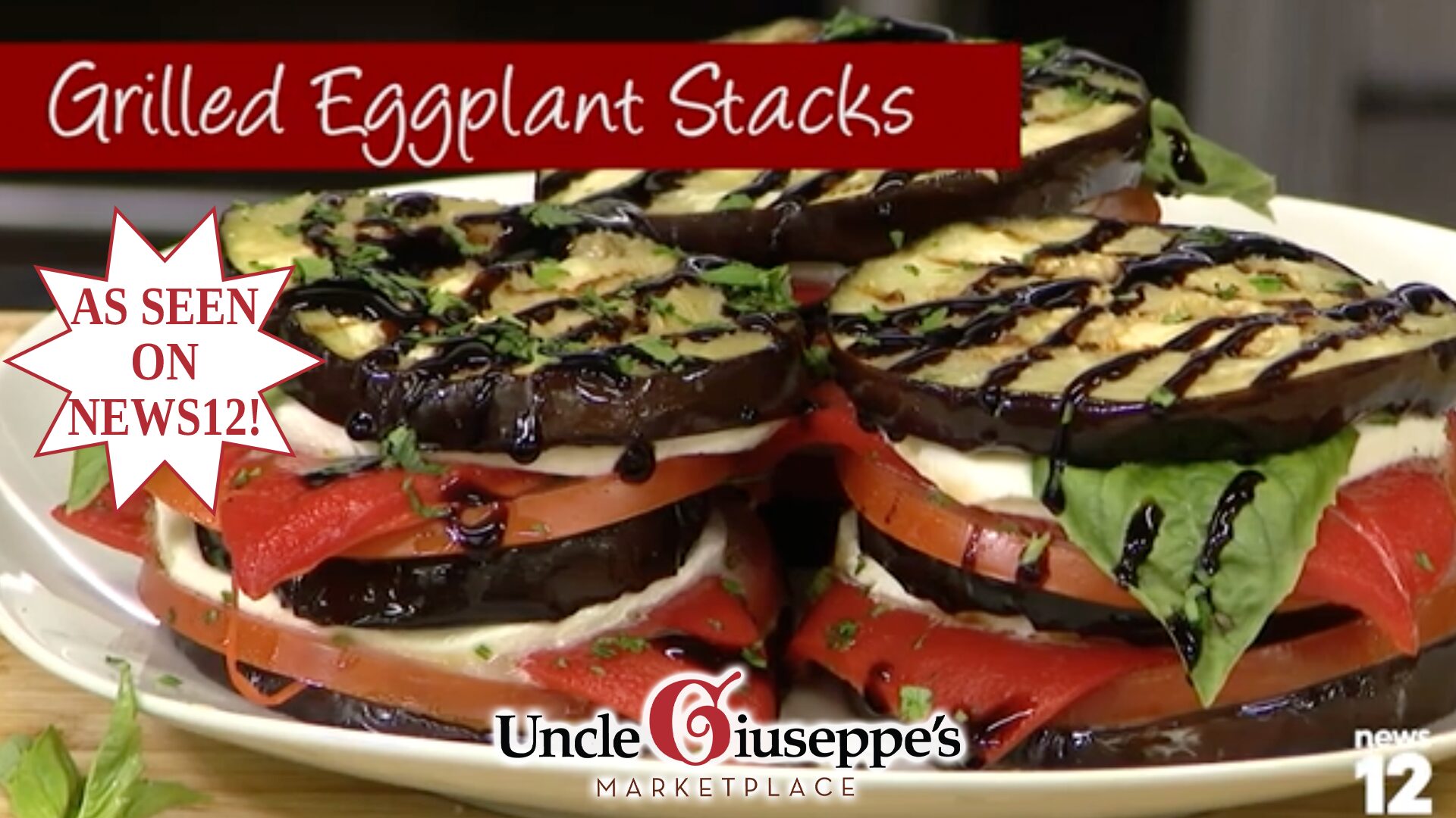 Grilled eggplant slices stacked with cheese and tomato