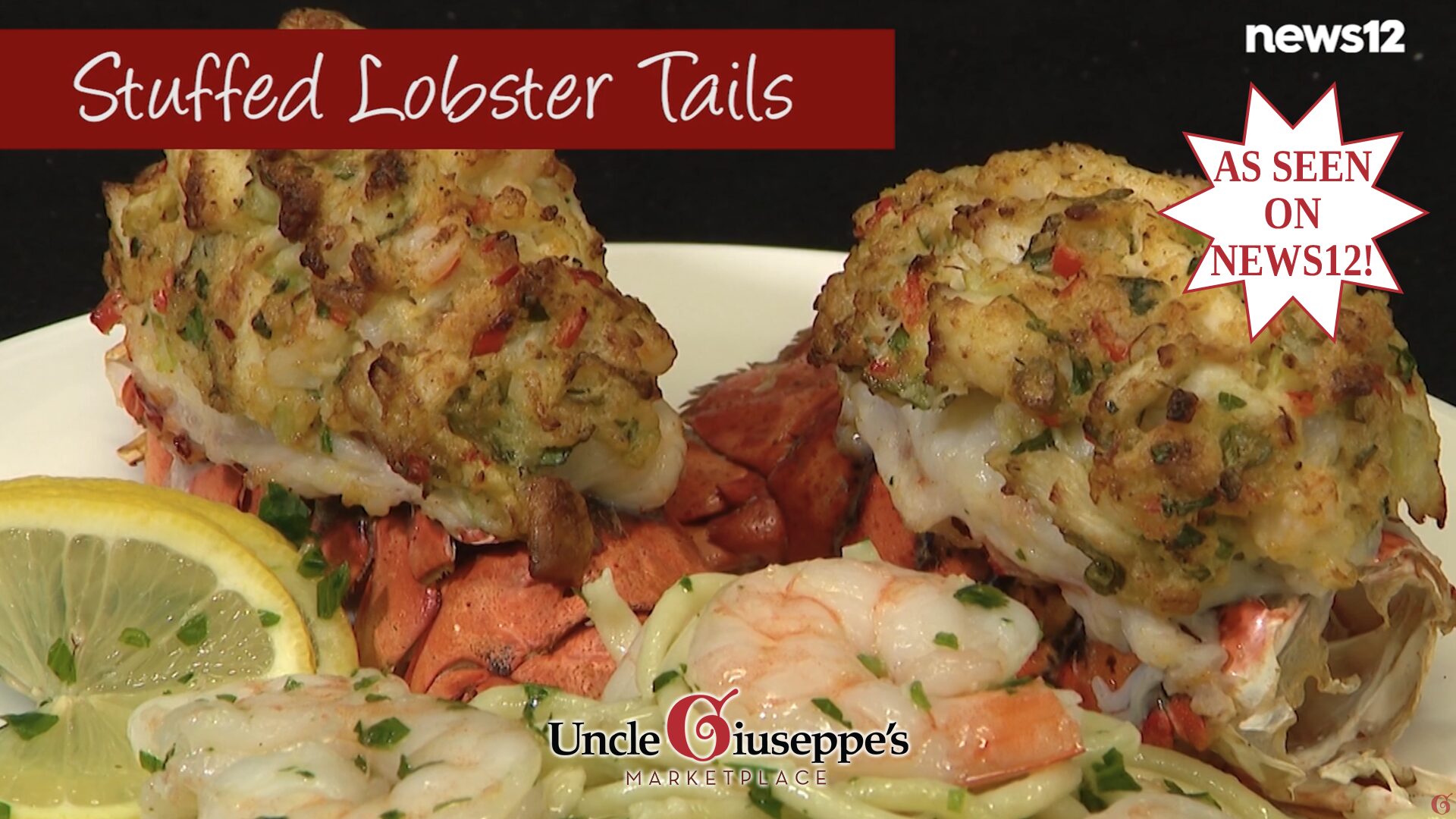 Stuffed lobster tails on a plate with pasta, shrimp and a lemon