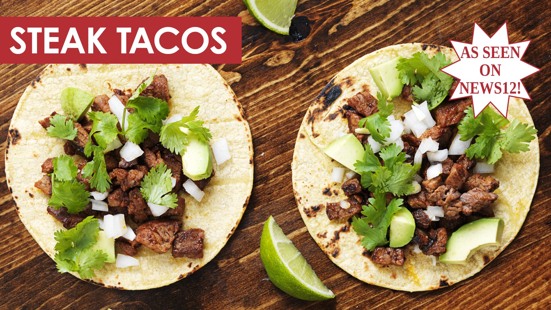 Steak tacos with two tortillas, steak, diced onions and cilantro on a dark wood cutting board.