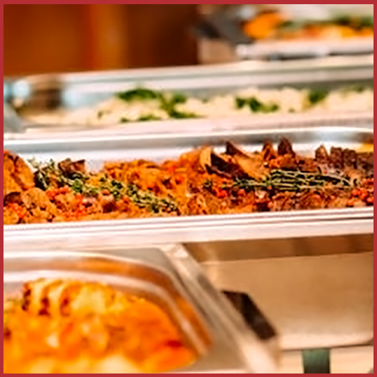 Catering trays filled with food ready to eat