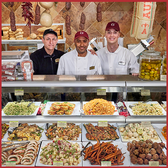 Uncle Giuseppe's deli section with three workers