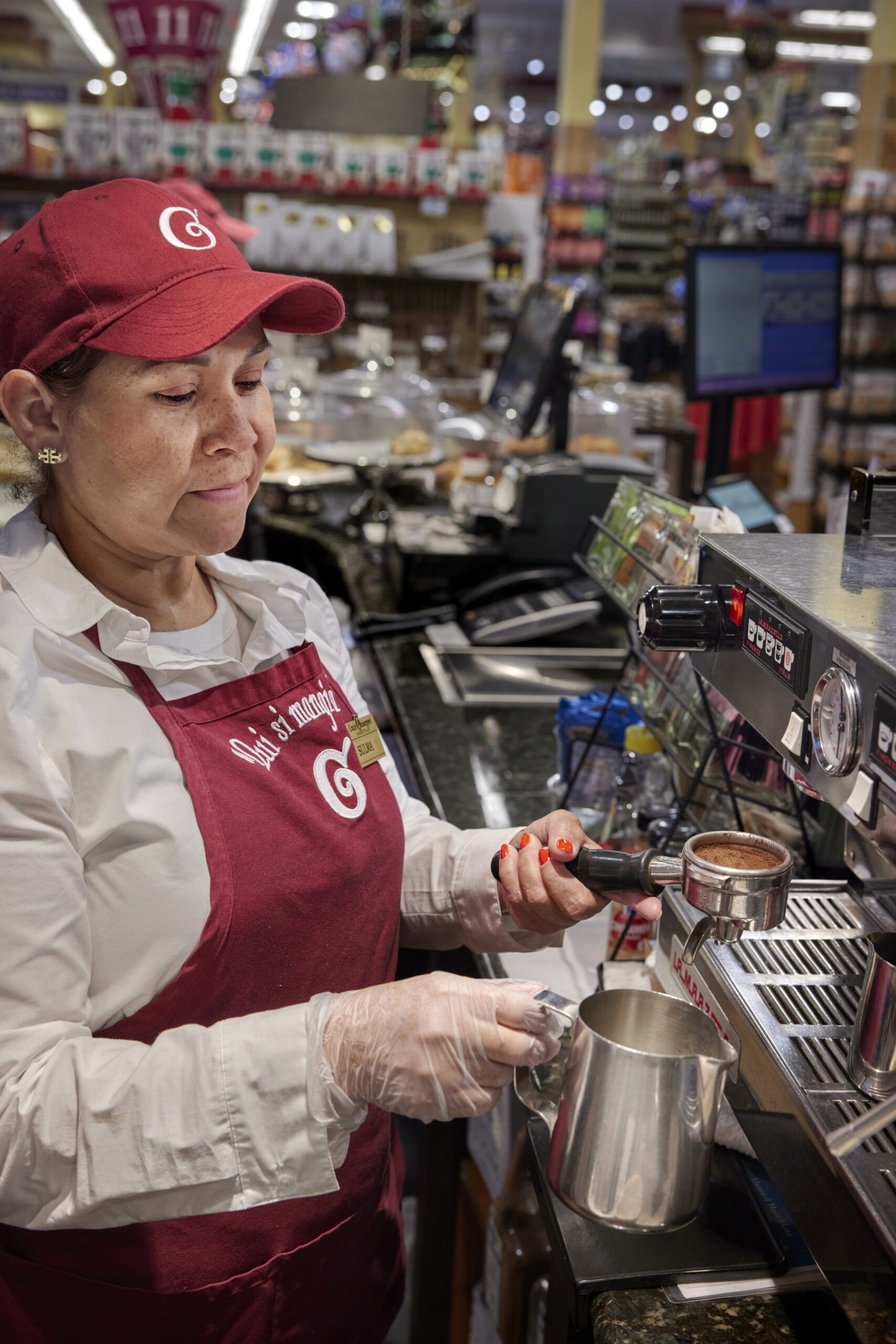 Barista steaming milk for a cappuccino. The Uncle Giuseppe's grocery store in Melville, NY. Photographed by John Muggenborg.

http://www.johnmuggenborg.com