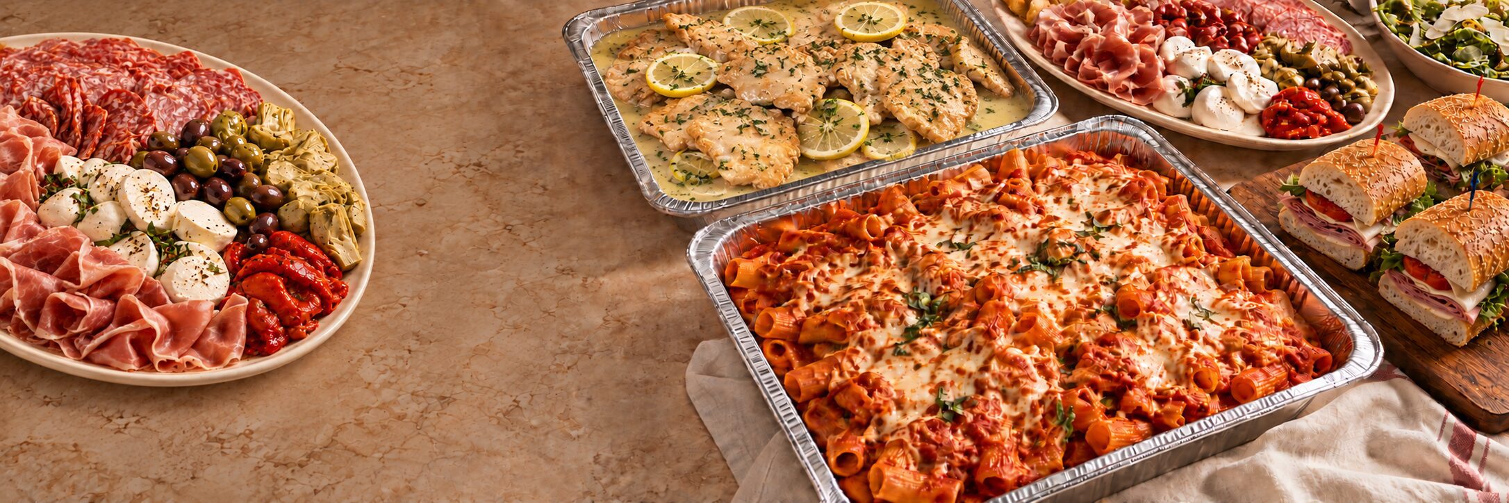 Uncle Giuseppe’s catering Italian spread with antipasto, baked pasta, chicken Francaise and party hero sandwiches